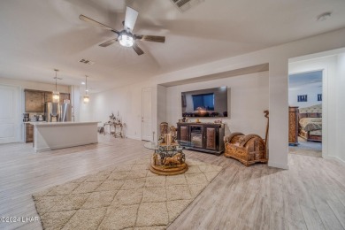 Located in prestigious gated neighborhood of The Canyons At on Laughlin Ranch Golf Club in Arizona - for sale on GolfHomes.com, golf home, golf lot