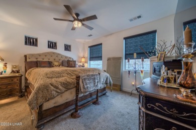 Located in prestigious gated neighborhood of The Canyons At on Laughlin Ranch Golf Club in Arizona - for sale on GolfHomes.com, golf home, golf lot