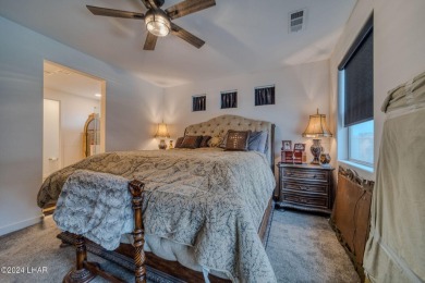 Located in prestigious gated neighborhood of The Canyons At on Laughlin Ranch Golf Club in Arizona - for sale on GolfHomes.com, golf home, golf lot