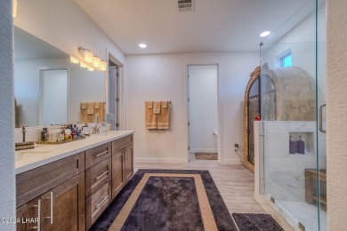 Located in prestigious gated neighborhood of The Canyons At on Laughlin Ranch Golf Club in Arizona - for sale on GolfHomes.com, golf home, golf lot