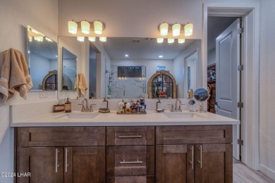 Located in prestigious gated neighborhood of The Canyons At on Laughlin Ranch Golf Club in Arizona - for sale on GolfHomes.com, golf home, golf lot