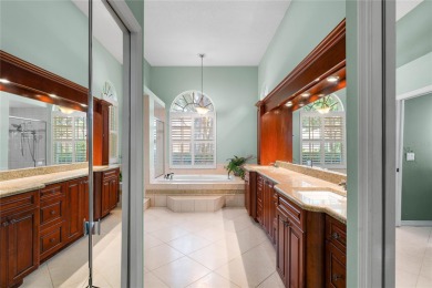 Welcome to this elegant residence in the highly sought-after on Hunters Green Country Club in Florida - for sale on GolfHomes.com, golf home, golf lot
