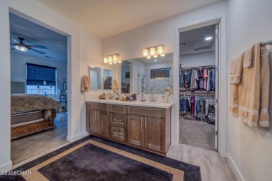Located in prestigious gated neighborhood of The Canyons At on Laughlin Ranch Golf Club in Arizona - for sale on GolfHomes.com, golf home, golf lot