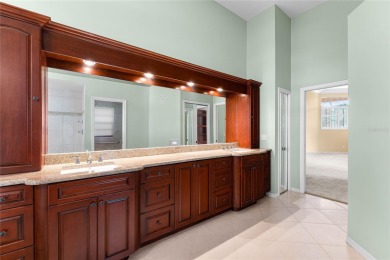 Welcome to this elegant residence in the highly sought-after on Hunters Green Country Club in Florida - for sale on GolfHomes.com, golf home, golf lot