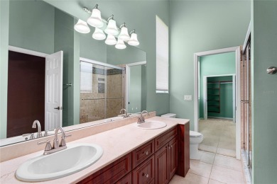 Welcome to this elegant residence in the highly sought-after on Hunters Green Country Club in Florida - for sale on GolfHomes.com, golf home, golf lot