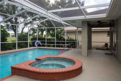 Welcome to this charming 3 bedroom, 3 bath pool home nestled in on Cypresswood Golf and Country Club in Florida - for sale on GolfHomes.com, golf home, golf lot