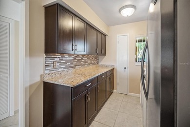 Don't miss this rare opportunity to own a light-filled on Palm Harbor Golf Club in Florida - for sale on GolfHomes.com, golf home, golf lot