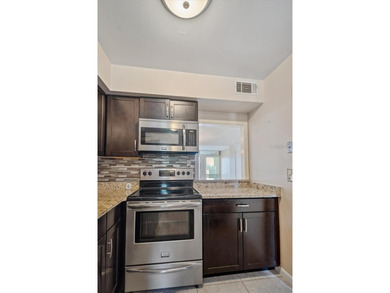 Don't miss this rare opportunity to own a light-filled on Palm Harbor Golf Club in Florida - for sale on GolfHomes.com, golf home, golf lot