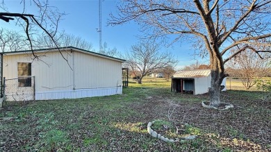 Welcome to Lake Fork Living! This charming 3-bedroom, 2-bathroom on Links At Lands End in Texas - for sale on GolfHomes.com, golf home, golf lot