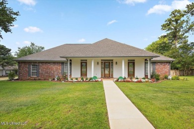 This beautifully maintained 4-bedroom, 2-bath gem nestled in the on Annandale Golf Club in Mississippi - for sale on GolfHomes.com, golf home, golf lot