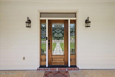 This beautifully maintained 4-bedroom, 2-bath gem nestled in the on Annandale Golf Club in Mississippi - for sale on GolfHomes.com, golf home, golf lot