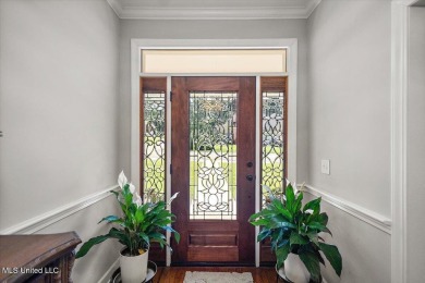 This beautifully maintained 4-bedroom, 2-bath gem nestled in the on Annandale Golf Club in Mississippi - for sale on GolfHomes.com, golf home, golf lot