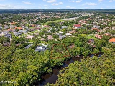 Tucked inside one of Florida's most distinctive GATED on Spruce Creek Golf Club in Florida - for sale on GolfHomes.com, golf home, golf lot