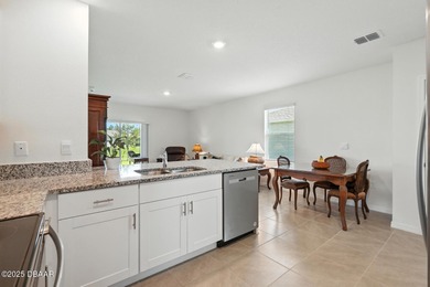 Discover the exceptional value of this pristine 2023 DR Horton on Halifax Plantation Golf Club in Florida - for sale on GolfHomes.com, golf home, golf lot