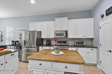 Looking for a beautiful well maintained pool home in an on King and Bear Golf Course/World Golf Village in Florida - for sale on GolfHomes.com, golf home, golf lot