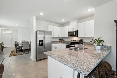 Discover the exceptional value of this pristine 2023 DR Horton on Halifax Plantation Golf Club in Florida - for sale on GolfHomes.com, golf home, golf lot