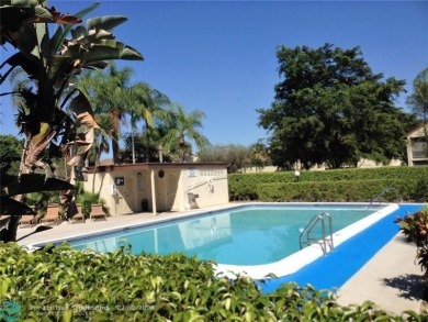 Laminated floor , tile. Golf view, 2nd floor, large balcony on Woodmont Country Club in Florida - for sale on GolfHomes.com, golf home, golf lot