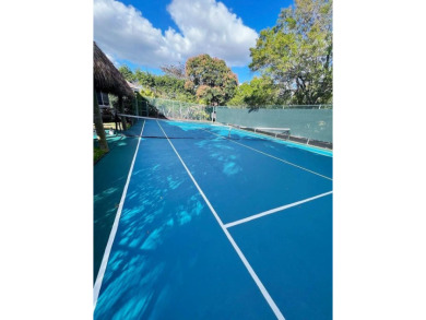 Just 4 min to WEF, this exceptionally secluded Tennis Court on The Wanderers Club in Florida - for sale on GolfHomes.com, golf home, golf lot