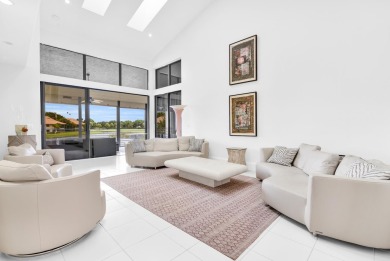 Stunning lake views are the showstopping feature of this on Boca Delray Golf and Country Club in Florida - for sale on GolfHomes.com, golf home, golf lot