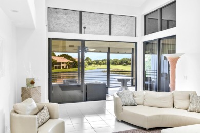 Stunning lake views are the showstopping feature of this on Boca Delray Golf and Country Club in Florida - for sale on GolfHomes.com, golf home, golf lot