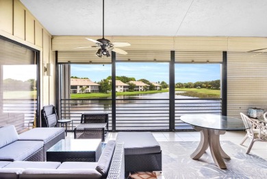Stunning lake views are the showstopping feature of this on Boca Delray Golf and Country Club in Florida - for sale on GolfHomes.com, golf home, golf lot