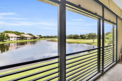 Stunning lake views are the showstopping feature of this on Boca Delray Golf and Country Club in Florida - for sale on GolfHomes.com, golf home, golf lot