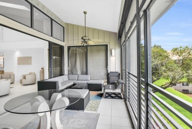 Stunning lake views are the showstopping feature of this on Boca Delray Golf and Country Club in Florida - for sale on GolfHomes.com, golf home, golf lot