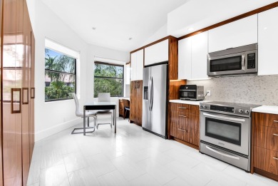 Stunning lake views are the showstopping feature of this on Boca Delray Golf and Country Club in Florida - for sale on GolfHomes.com, golf home, golf lot