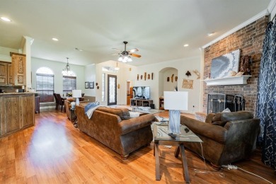 BEAUTIFUL STONE AND BRICK HOME on the par 3, 14th hole of the on Pecan Plantation Country Club in Texas - for sale on GolfHomes.com, golf home, golf lot