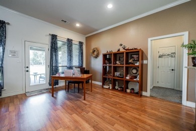 BEAUTIFUL STONE AND BRICK HOME on the par 3, 14th hole of the on Pecan Plantation Country Club in Texas - for sale on GolfHomes.com, golf home, golf lot
