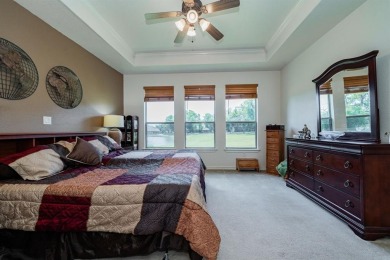 BEAUTIFUL STONE AND BRICK HOME on the par 3, 14th hole of the on Pecan Plantation Country Club in Texas - for sale on GolfHomes.com, golf home, golf lot