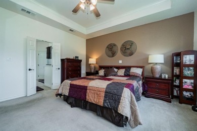 BEAUTIFUL STONE AND BRICK HOME on the par 3, 14th hole of the on Pecan Plantation Country Club in Texas - for sale on GolfHomes.com, golf home, golf lot