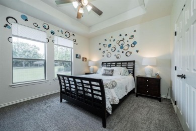 BEAUTIFUL STONE AND BRICK HOME on the par 3, 14th hole of the on Pecan Plantation Country Club in Texas - for sale on GolfHomes.com, golf home, golf lot
