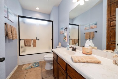 BEAUTIFUL STONE AND BRICK HOME on the par 3, 14th hole of the on Pecan Plantation Country Club in Texas - for sale on GolfHomes.com, golf home, golf lot