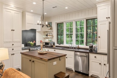 Welcome to this charming custom cottage, nestled among lush on Natures Walk At Chinquapin in North Carolina - for sale on GolfHomes.com, golf home, golf lot