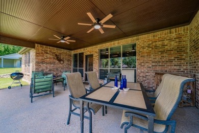 BEAUTIFUL STONE AND BRICK HOME on the par 3, 14th hole of the on Pecan Plantation Country Club in Texas - for sale on GolfHomes.com, golf home, golf lot