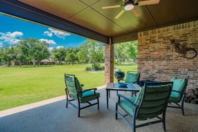 BEAUTIFUL STONE AND BRICK HOME on the par 3, 14th hole of the on Pecan Plantation Country Club in Texas - for sale on GolfHomes.com, golf home, golf lot