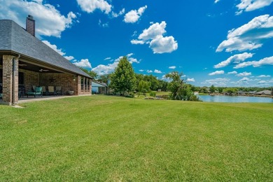 BEAUTIFUL STONE AND BRICK HOME on the par 3, 14th hole of the on Pecan Plantation Country Club in Texas - for sale on GolfHomes.com, golf home, golf lot
