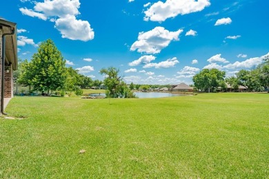 BEAUTIFUL STONE AND BRICK HOME on the par 3, 14th hole of the on Pecan Plantation Country Club in Texas - for sale on GolfHomes.com, golf home, golf lot