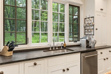Welcome to this charming custom cottage, nestled among lush on Natures Walk At Chinquapin in North Carolina - for sale on GolfHomes.com, golf home, golf lot