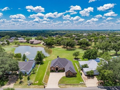 BEAUTIFUL STONE AND BRICK HOME on the par 3, 14th hole of the on Pecan Plantation Country Club in Texas - for sale on GolfHomes.com, golf home, golf lot