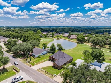 BEAUTIFUL STONE AND BRICK HOME on the par 3, 14th hole of the on Pecan Plantation Country Club in Texas - for sale on GolfHomes.com, golf home, golf lot
