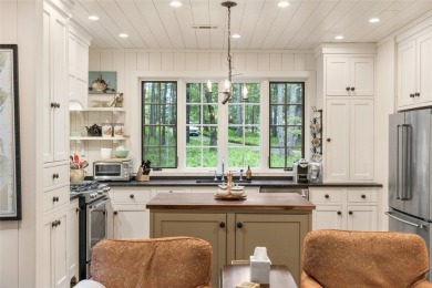 Welcome to this charming custom cottage, nestled among lush on Natures Walk At Chinquapin in North Carolina - for sale on GolfHomes.com, golf home, golf lot