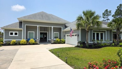 This beautifully landscaped property is situated directly on the on Wild Wing Plantation in South Carolina - for sale on GolfHomes.com, golf home, golf lot
