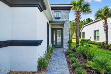 The Arbor II Townhome features a low-maintenance design with a on Plantation Bay Golf and Country Club in Florida - for sale on GolfHomes.com, golf home, golf lot