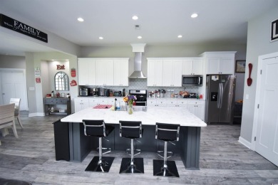 This beautifully landscaped property is situated directly on the on Wild Wing Plantation in South Carolina - for sale on GolfHomes.com, golf home, golf lot