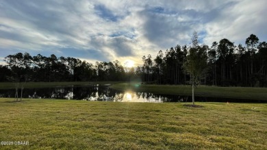 The Arbor II Townhome features a low-maintenance design with a on Plantation Bay Golf and Country Club in Florida - for sale on GolfHomes.com, golf home, golf lot
