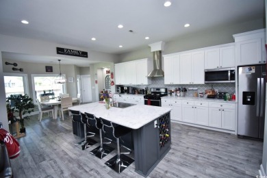 This beautifully landscaped property is situated directly on the on Wild Wing Plantation in South Carolina - for sale on GolfHomes.com, golf home, golf lot
