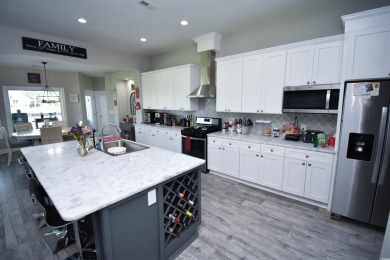 This beautifully landscaped property is situated directly on the on Wild Wing Plantation in South Carolina - for sale on GolfHomes.com, golf home, golf lot