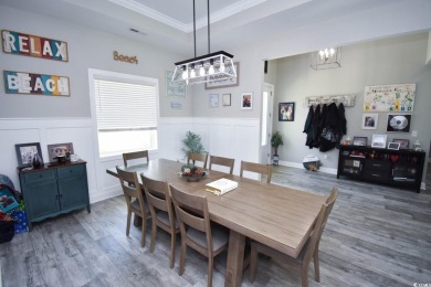 This beautifully landscaped property is situated directly on the on Wild Wing Plantation in South Carolina - for sale on GolfHomes.com, golf home, golf lot